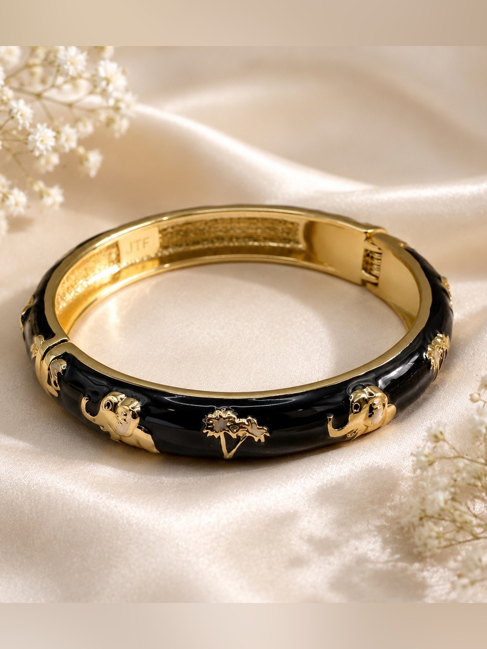 Gold-Tone Black Enamel Bangle Bracelet with Elephant Motif